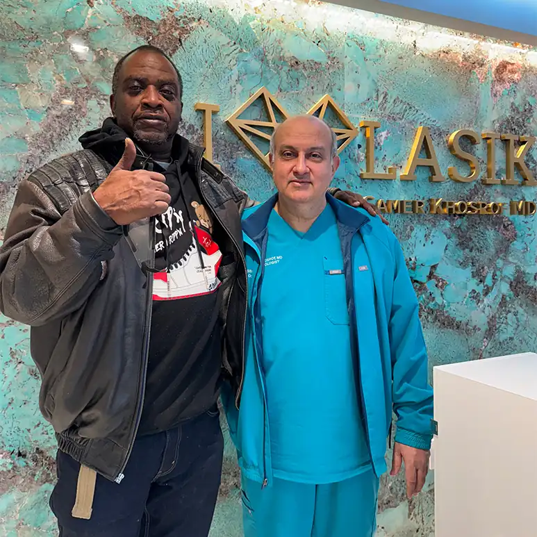 Dr. Khosorf standing with a happy patient