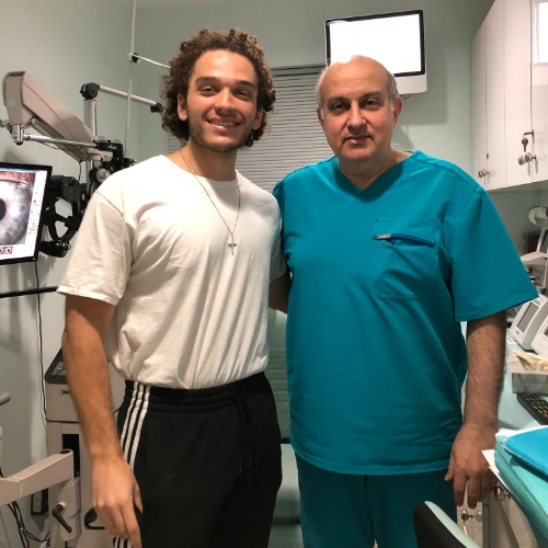 Happy male patient next to Dr. Khosrof