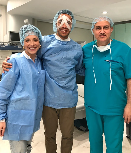Dr. Khosrof next to patient after eye surgery
