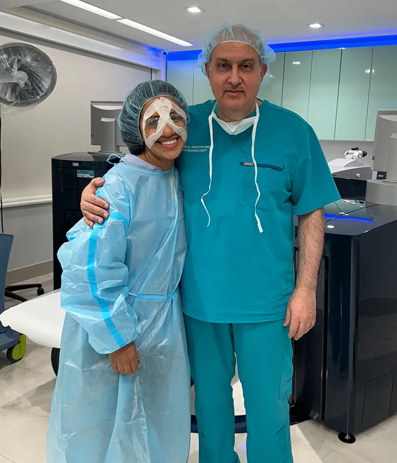 Dr. Khosrof next to patient after LASIK eye procedure