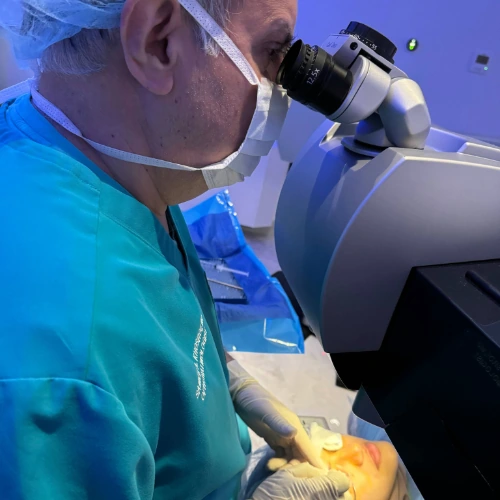 Dr. Kosrof operating on patient's eye