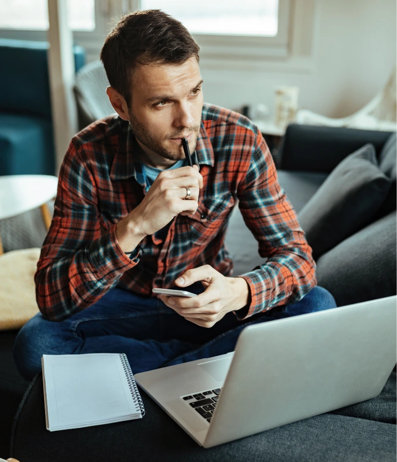 man thinking while using computer