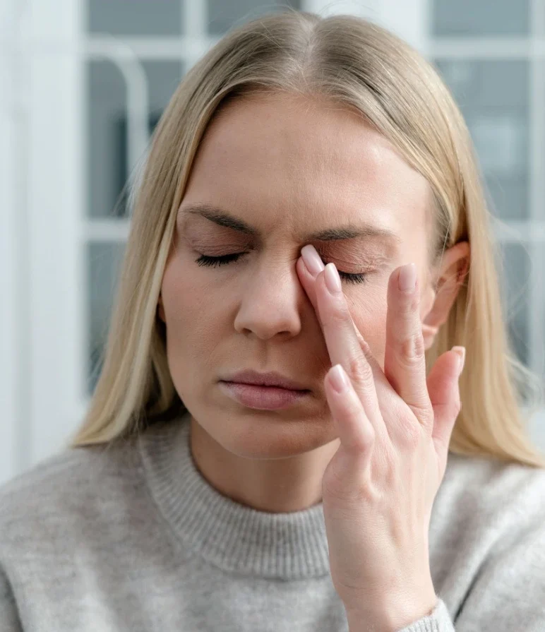 woman rubbing dry eyes