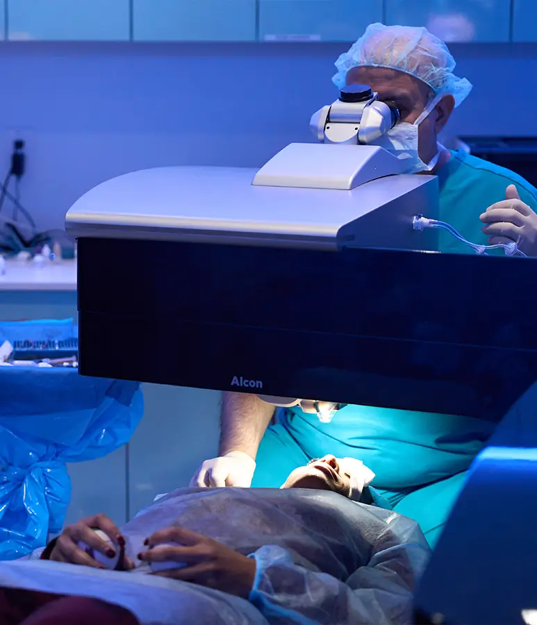 dr khosrof operating on a patients eyes