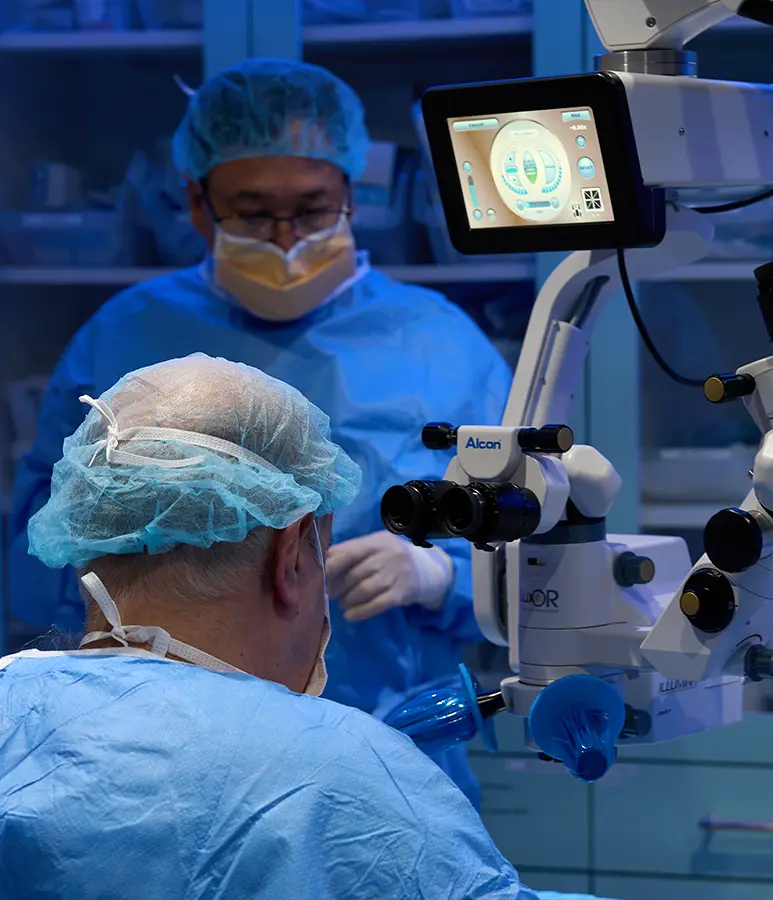 i love lasik doctors working in an operating room with advanced lasik technology