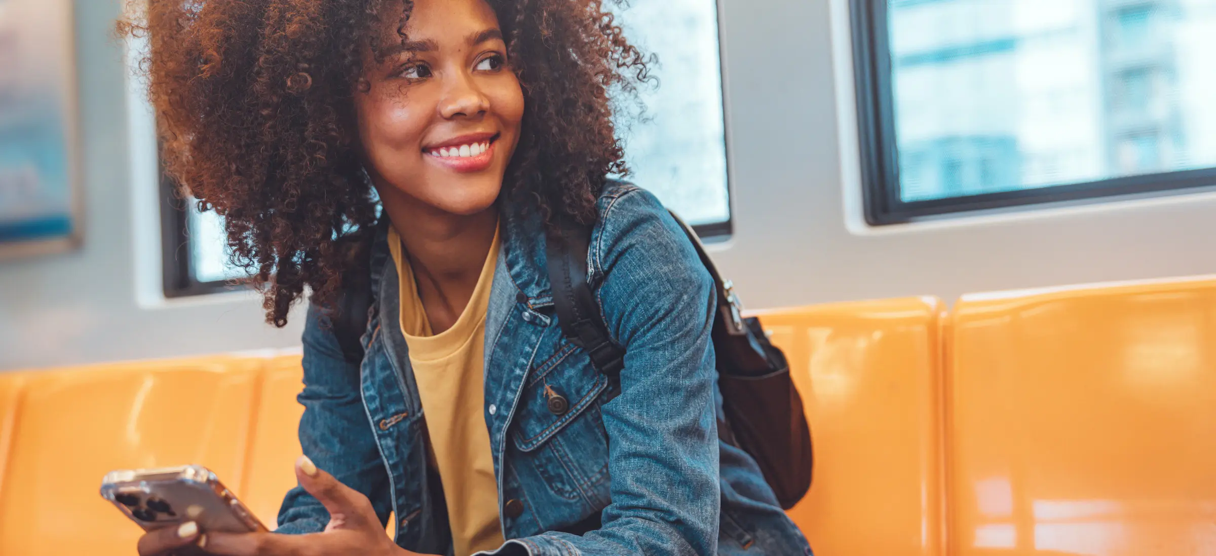 woman using phone on subway