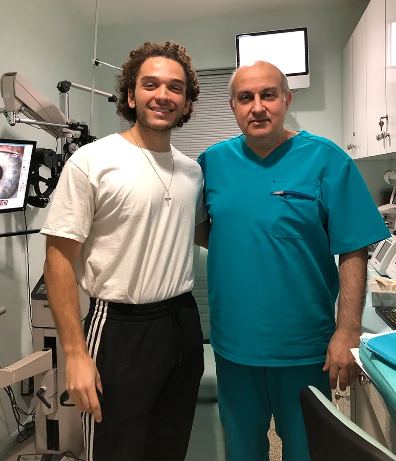 Happy male patient next to Dr. Khosrof