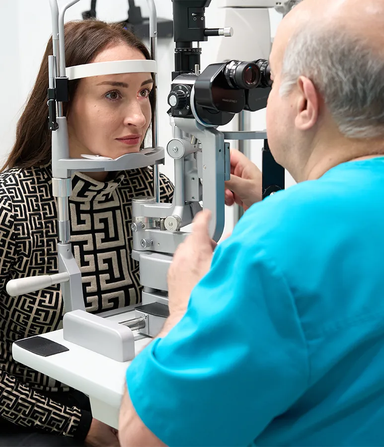 Dr. Khosrof examining patient's eye health