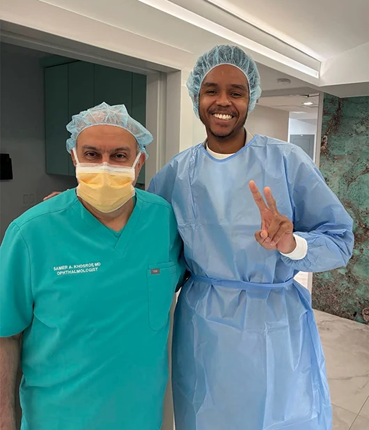 happy RLE patient, an FBI officer, standing next to Dr. Khosrof after procedure
